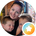 Google review photo of a smiling customer with her two children